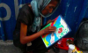 BE INSPIRED: Homeless Old Woman Sells Her Artworks for P15 In The Streets To Survive